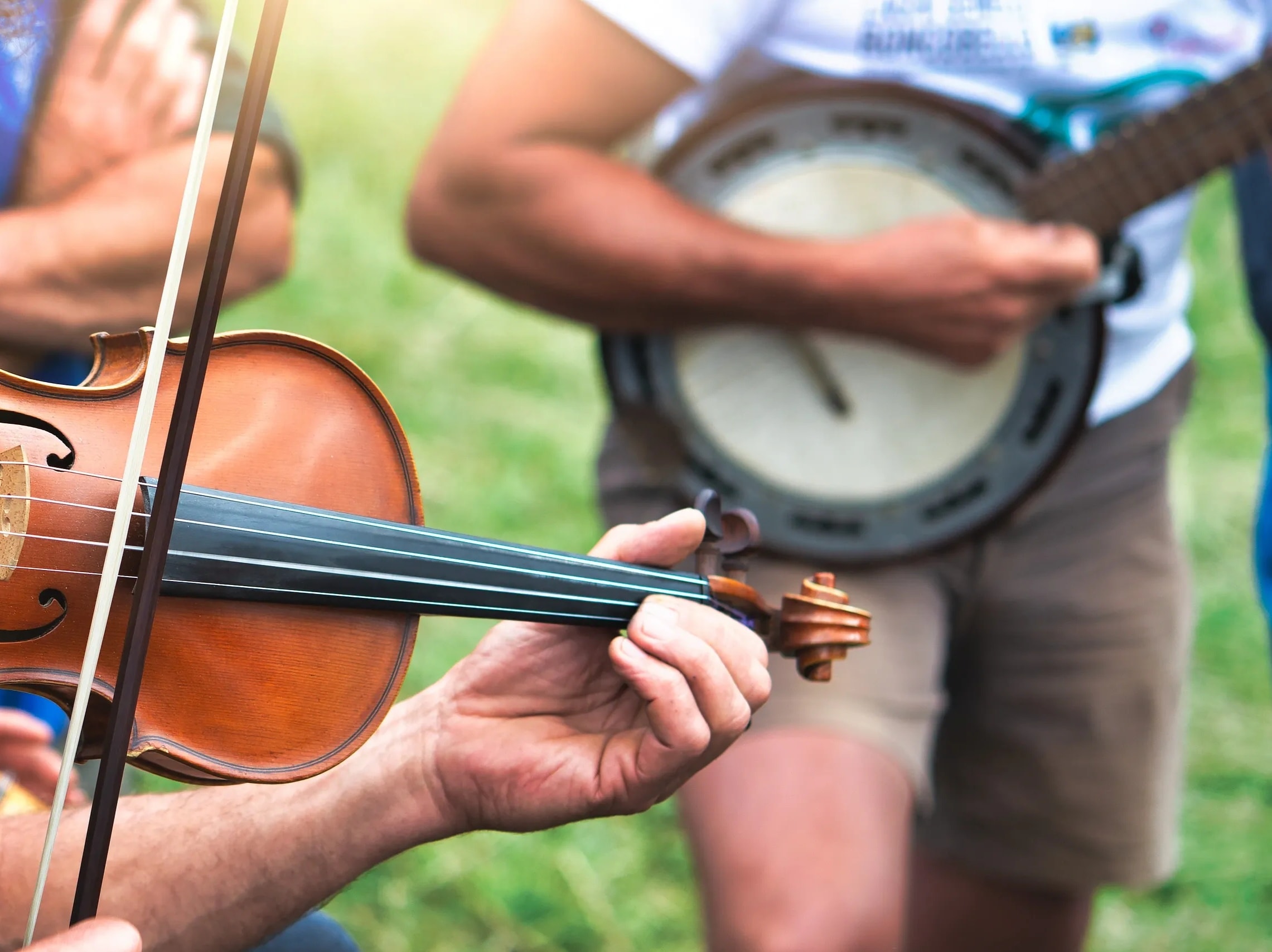 Traditional music session in an Irish pub with fiddle and banjo