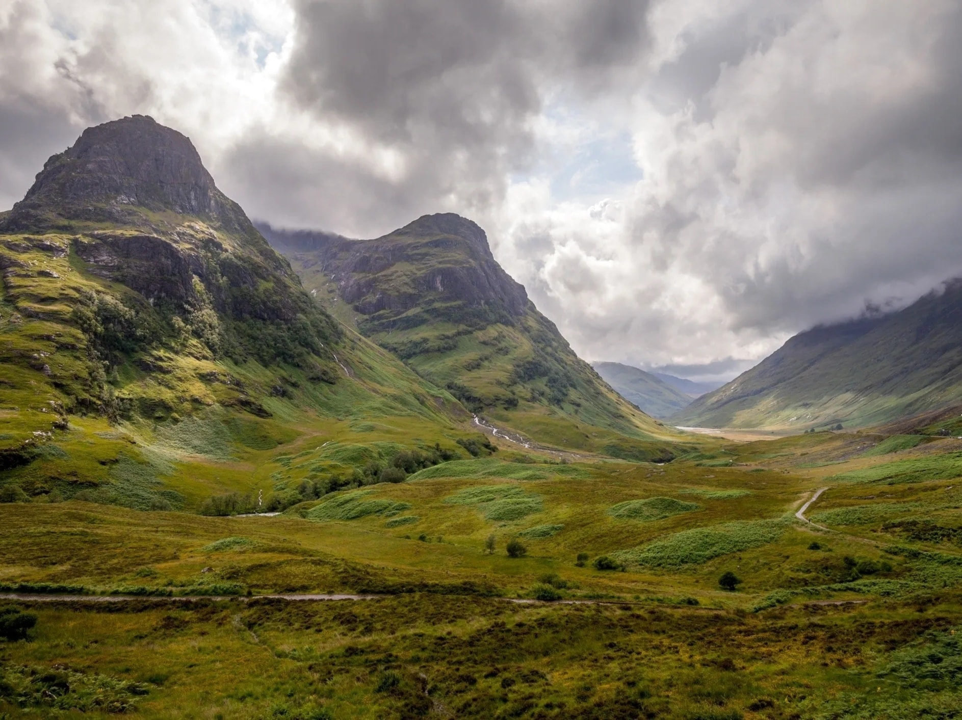 Dramatic misty Scottish Highlands mountains and glen
