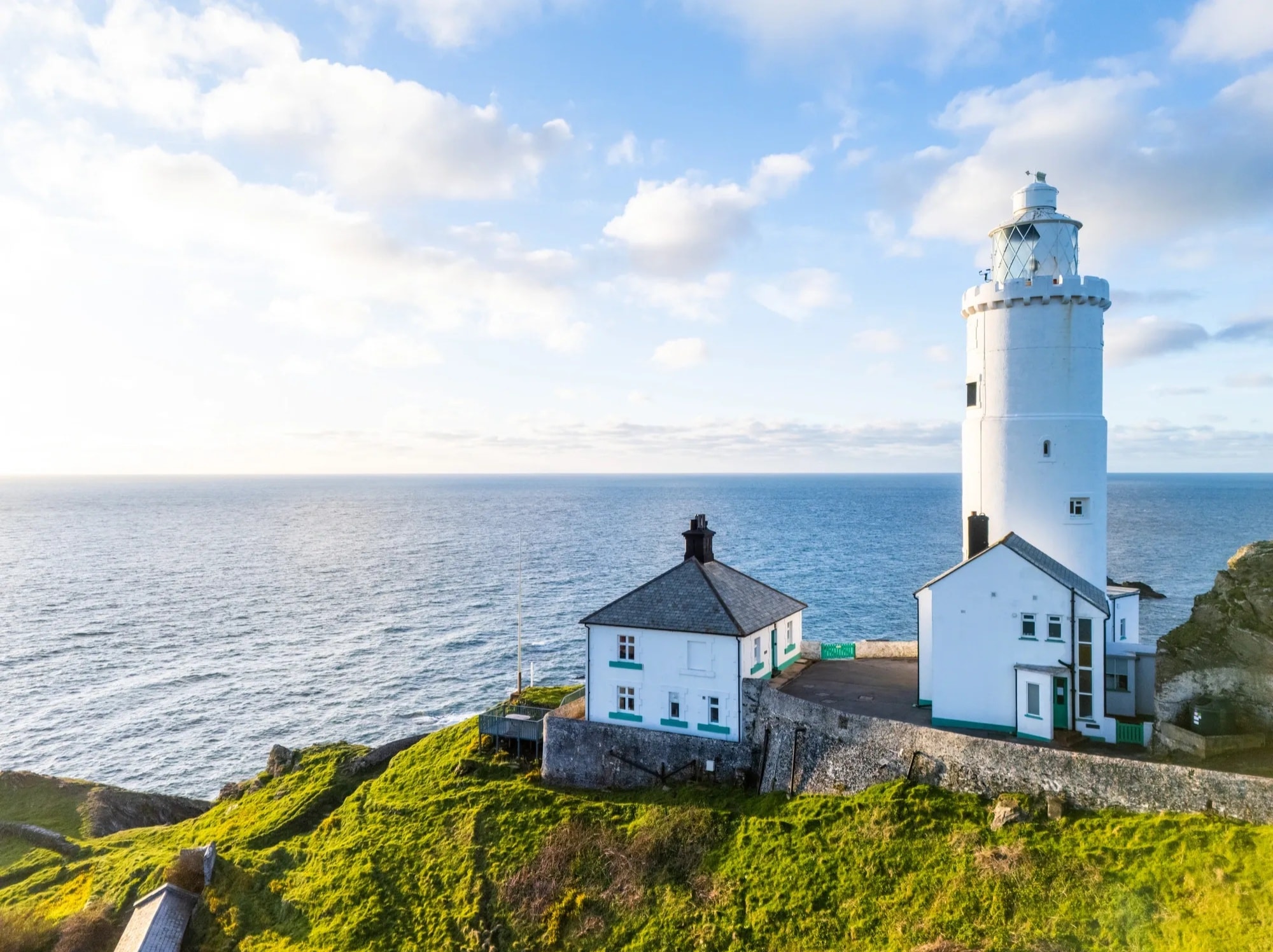 Lighthouse cottage on dramatic coastal cliffs Ireland
