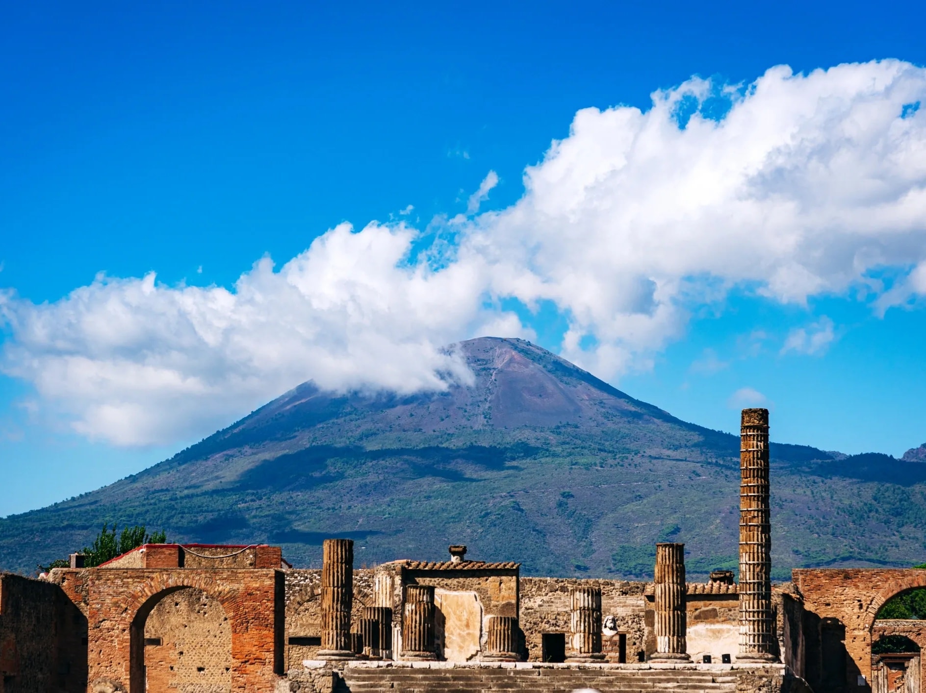 Ancient ruins of Pompeii with Mount Vesuvius in the background